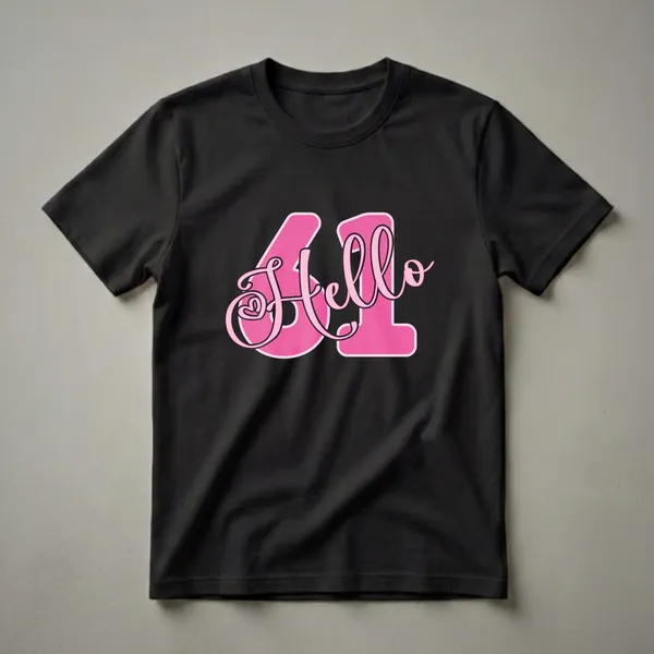 A black t-shirt featuring a graphic design with the number 61 and the word 'Hello' in bright pink with a lighter pink outline.