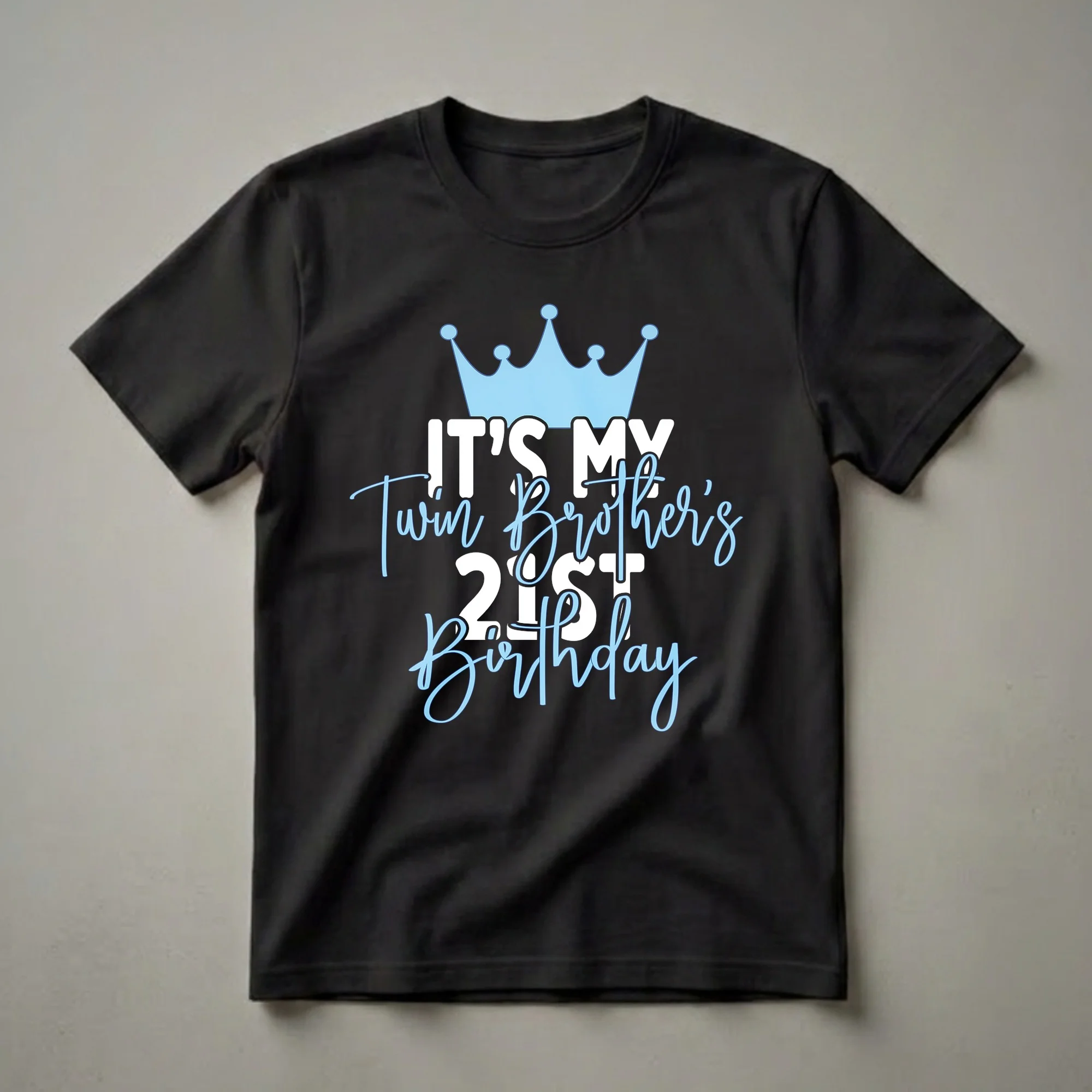 Black t-shirt with a light blue crown and text that reads 'IT'S MY Twin Brother's 21ST Birthday' in white and light blue.