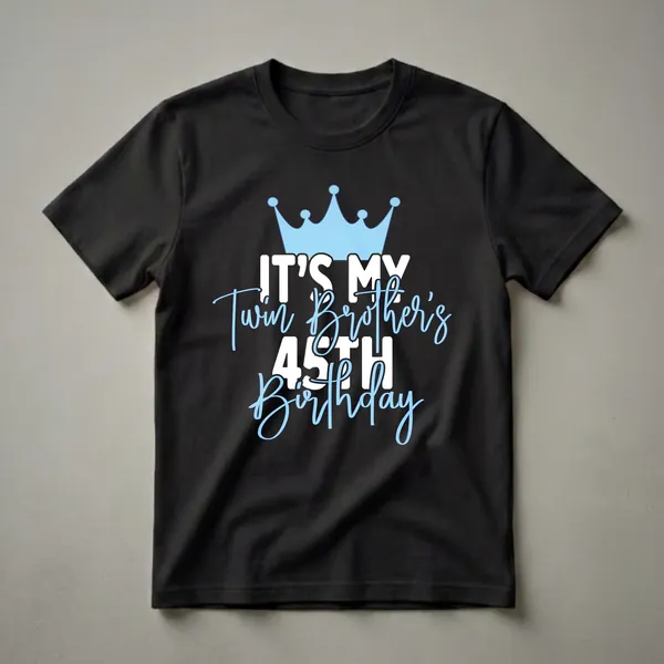 Black t-shirt with a light blue crown and white and light blue text that reads 'IT'S MY Twin Brother's 45TH Birthday'.