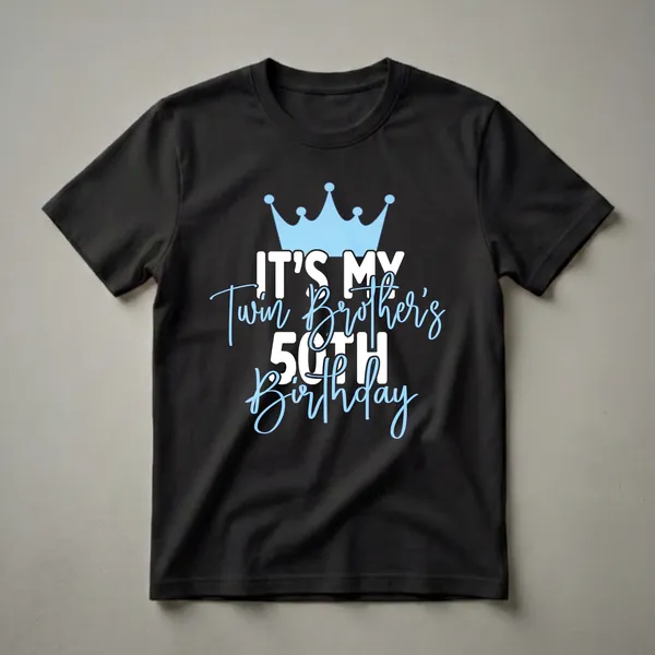 Black t-shirt with a light blue crown and white and light blue text that reads 'IT'S MY Twin Brother's 50TH Birthday'.