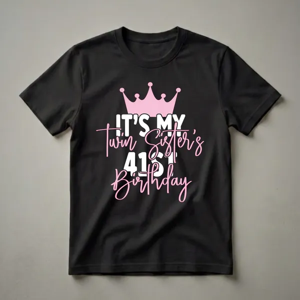Black t-shirt with a pink crown graphic and white and pink text that reads 'IT'S MY Twin Sister's 41st Birthday'.