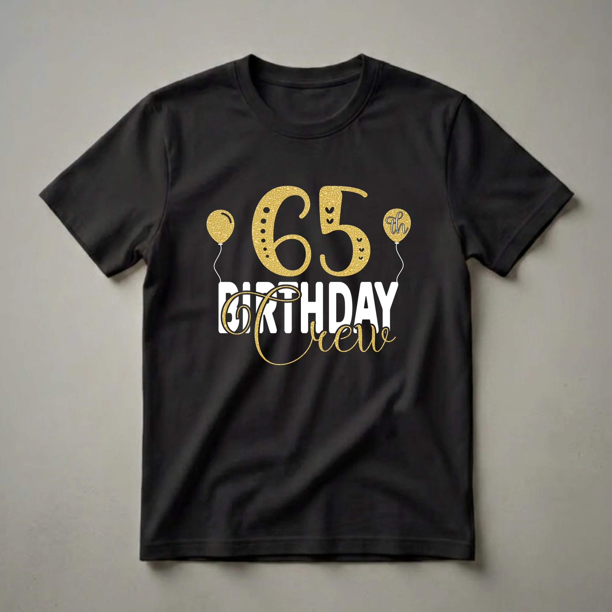 Black t-shirt with gold glitter and white text that reads "65th Birthday Crew" with gold balloons.