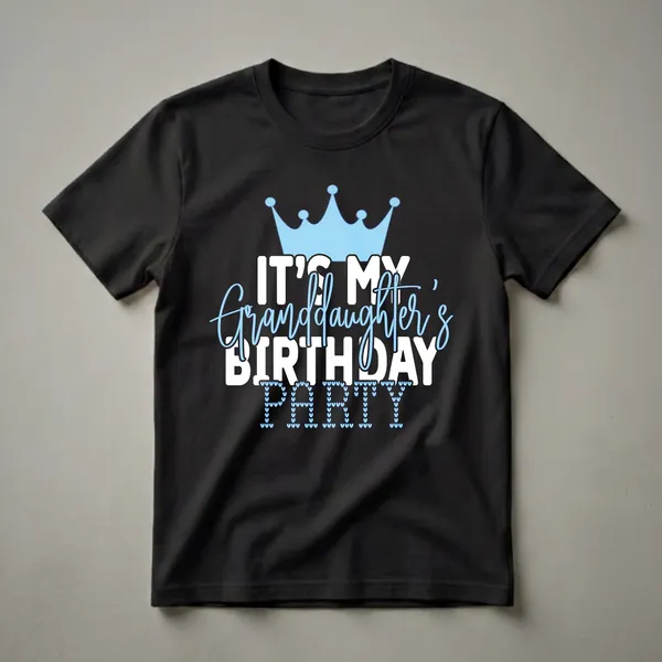 White graphic t-shirt with a light blue crown and the text 'IT'S MY GRANDDAUGHTER'S BIRTHDAY PARTY', where 'PARTY' is formed by small light blue hearts.