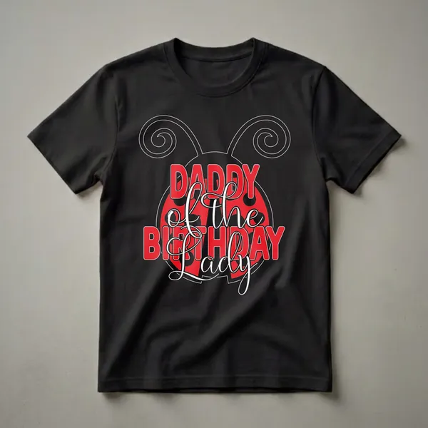 Black t-shirt with a red and white ladybug graphic and the text 'Daddy of the Birthday Lady' in red and white lettering.