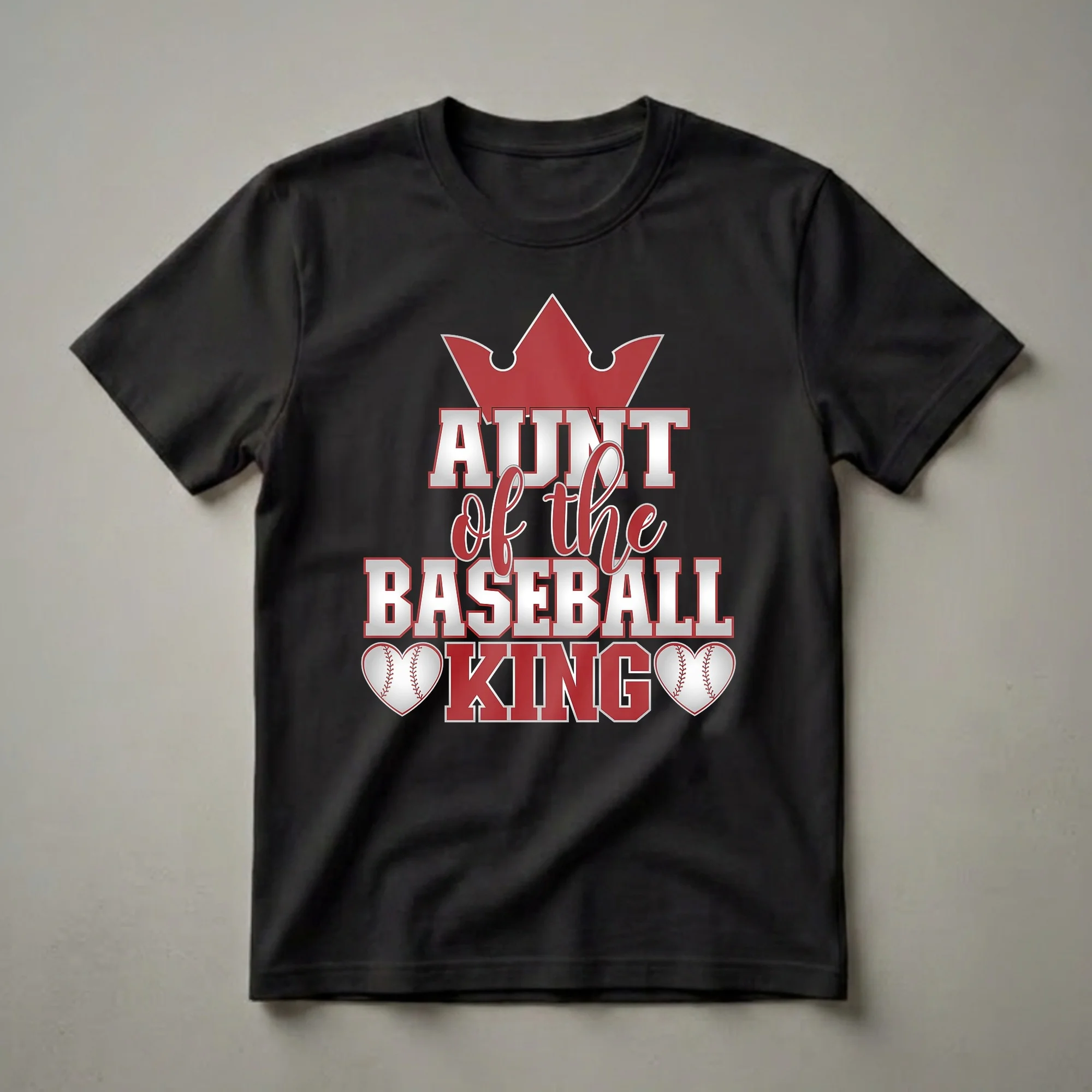Black t-shirt with red and silver text that reads 'Aunt of the Baseball King', featuring a crown above and baseball heart graphics below.