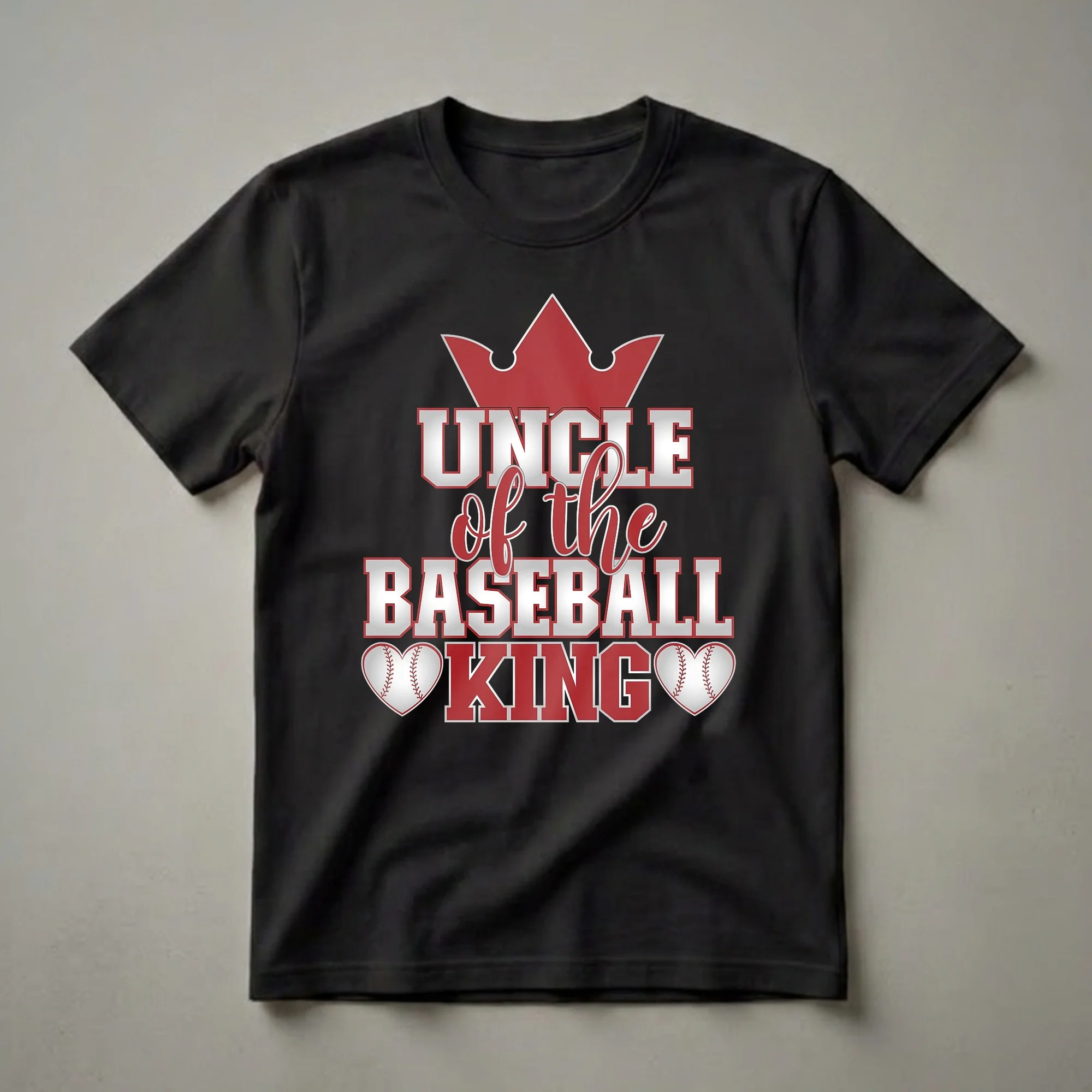 Black t-shirt with red crown and silver and red text reading 'Uncle of the Baseball King', with two baseball heart graphics on the sides.