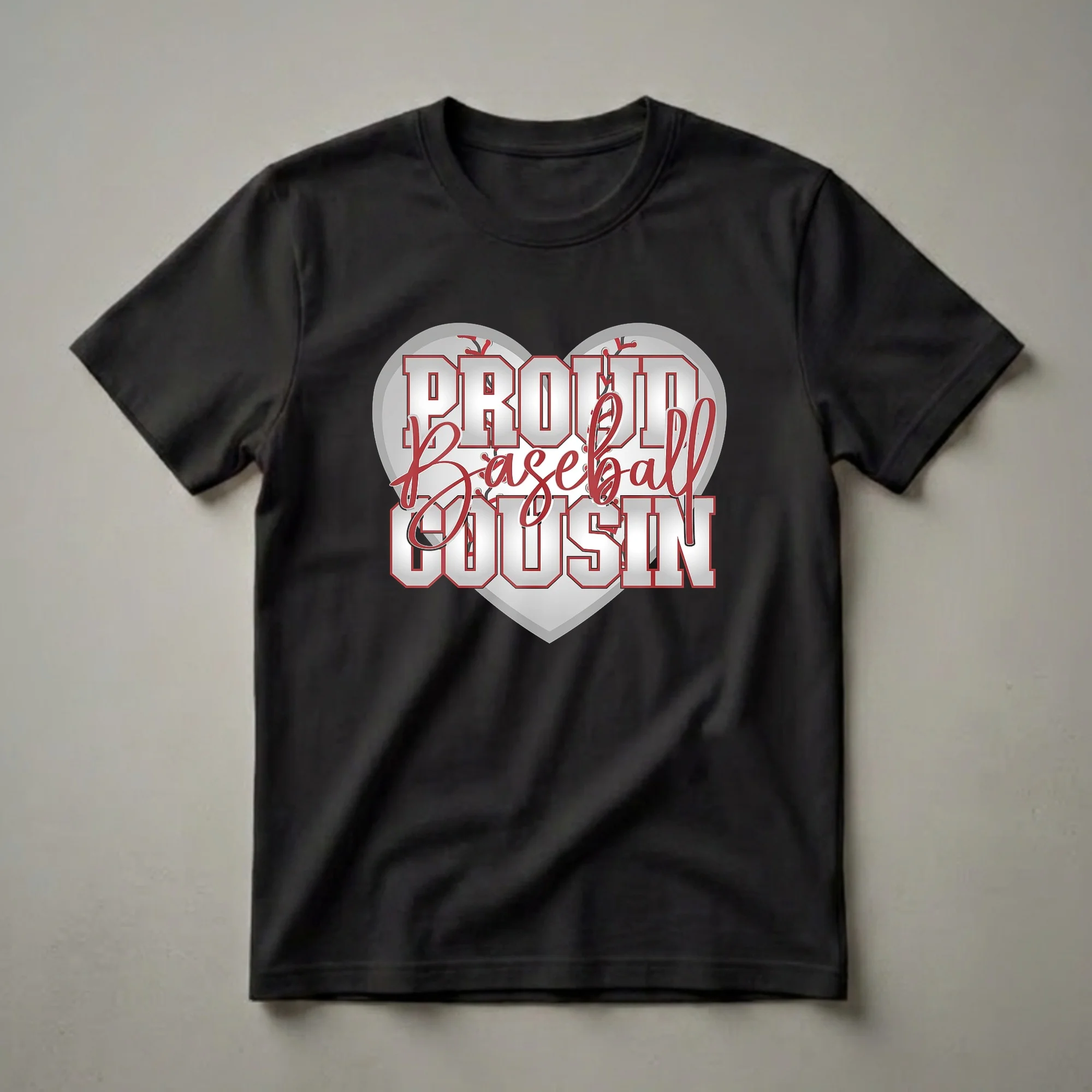 White graphic t-shirt with 'Proud Baseball Cousin' text in metallic silver and red, set against a baseball heart graphic with red stitching.