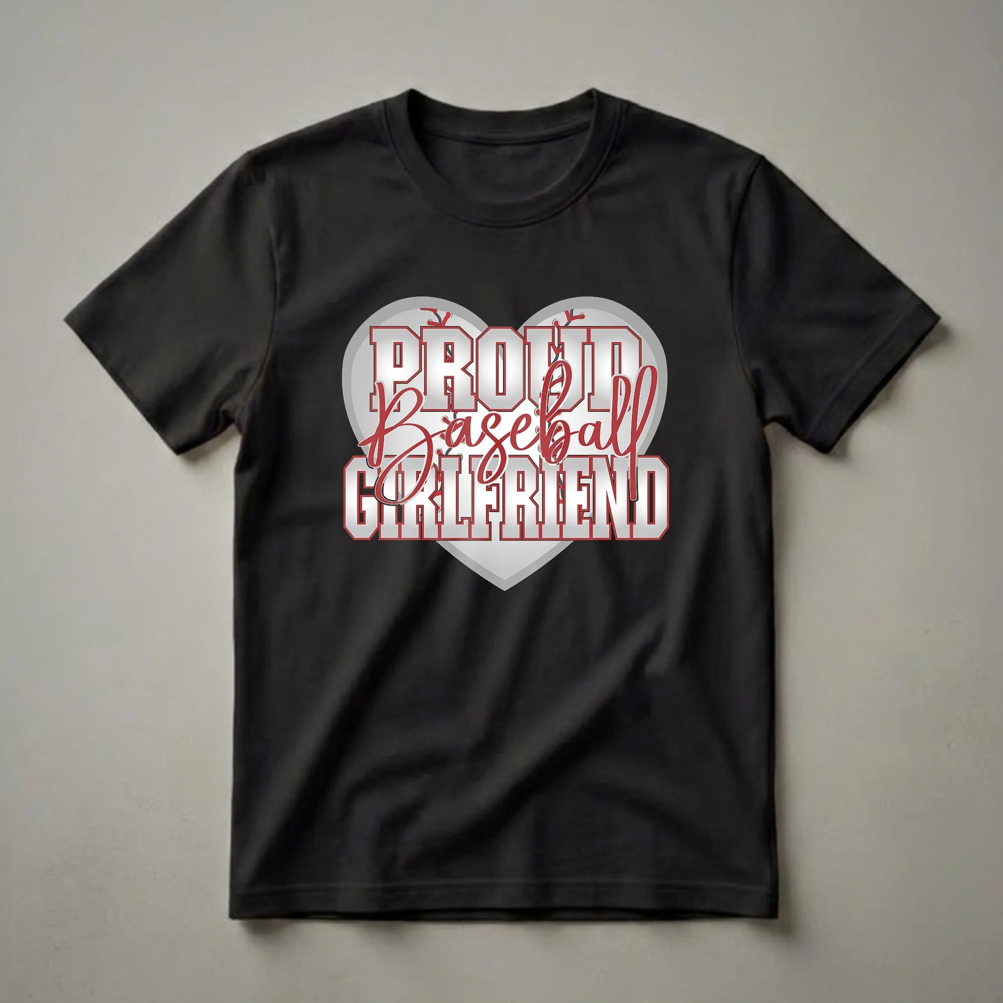 White and red 'Proud Baseball Girlfriend' text graphic inside a heart shape with baseball stitching, on a black background.