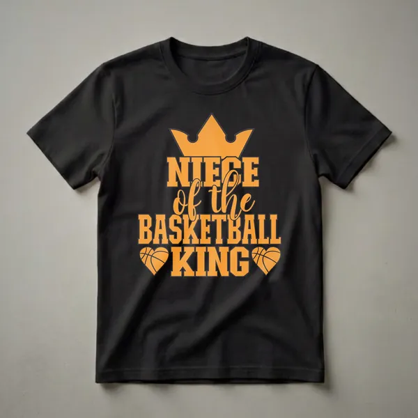 Black t-shirt with orange text that reads 'NIECE of the BASKETBALL KING', topped with a crown and flanked by basketball hearts.