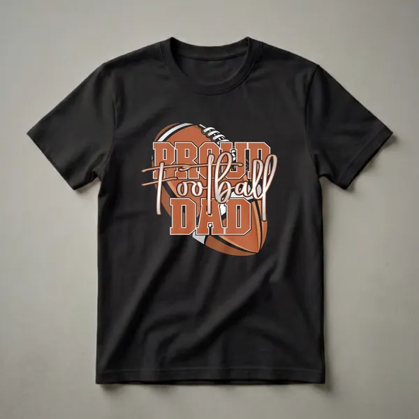 Black t-shirt with a graphic design of a football and the words 'Proud Football Dad' in orange and silver.