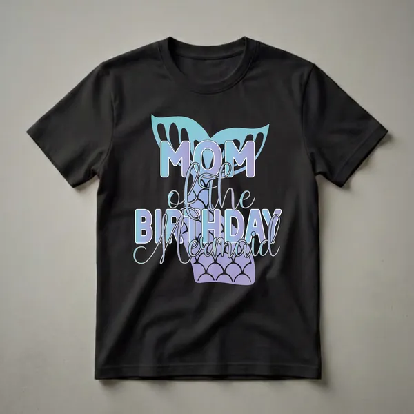 Black t-shirt featuring the text 'Mom of the Birthday Mermaid' in gradient blue and purple, with a teal and purple mermaid tail and fins graphic.