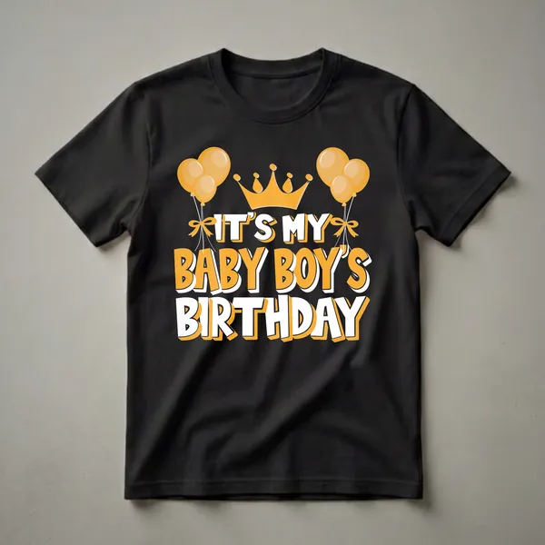 Black t-shirt with orange and white text that reads 'IT'S MY BABY BOY'S BIRTHDAY', topped with a golden crown and flanked by orange balloons.