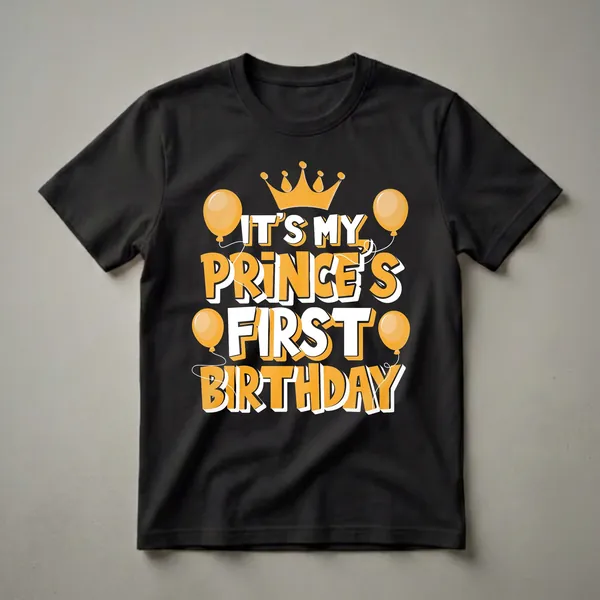 Black t-shirt with orange and white text that reads 'IT'S MY PRINCE'S FIRST BIRTHDAY' and features an orange crown and orange balloons.