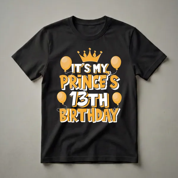 Black t-shirt with bold orange and white text that reads 'IT'S MY PRINCE'S 13TH BIRTHDAY', topped with an orange crown and surrounded by orange balloons.