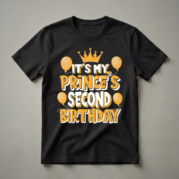 Black t-shirt with orange and white text that reads "IT'S MY PRINCE'S SECOND BIRTHDAY" and features an orange crown and orange balloons.
