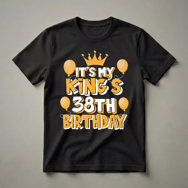 Black t-shirt with orange and white text that reads 'IT'S MY KING'S 38TH BIRTHDAY' with a crown and balloons graphic.