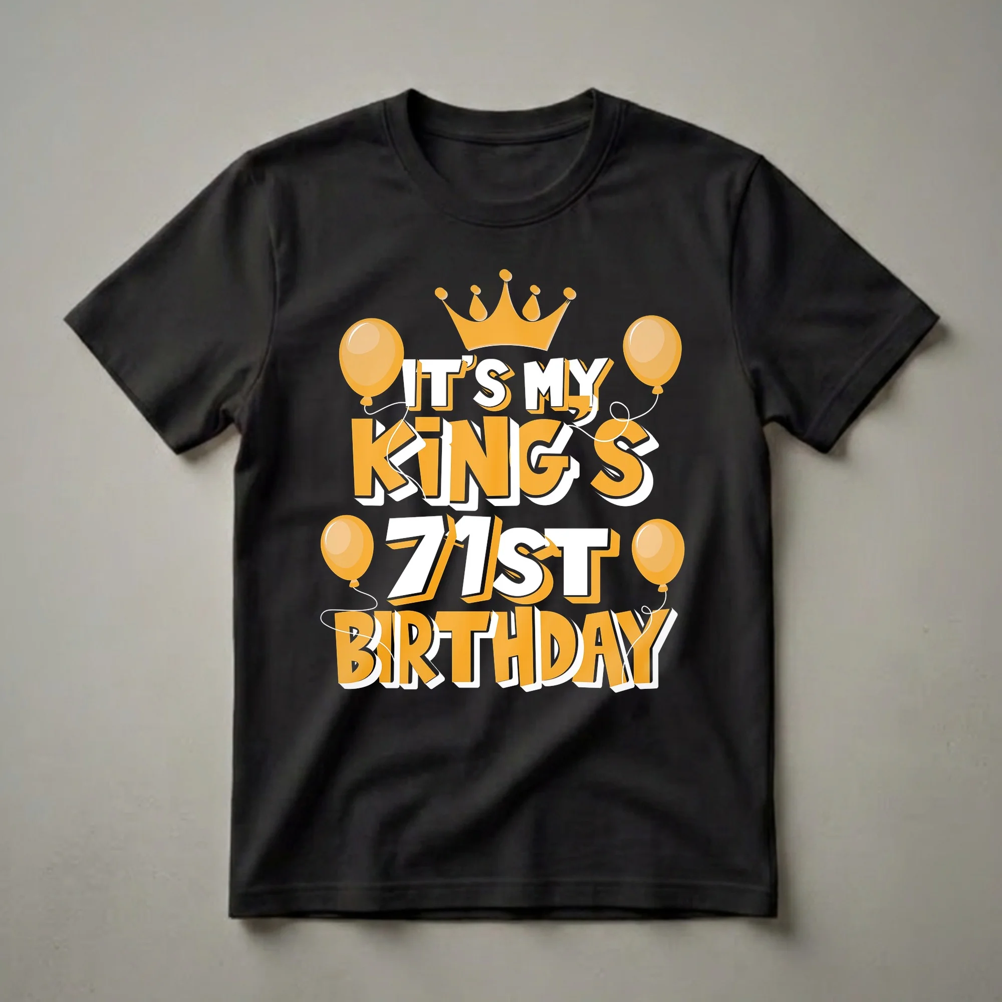 Black t-shirt with orange and white text that reads 'IT'S MY KING'S 71ST BIRTHDAY', featuring a golden crown and orange balloons.