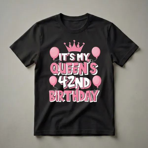 Black t-shirt with pink and white text reading 'It's My Queen's 42nd Birthday' surrounded by pink balloons and a pink crown.