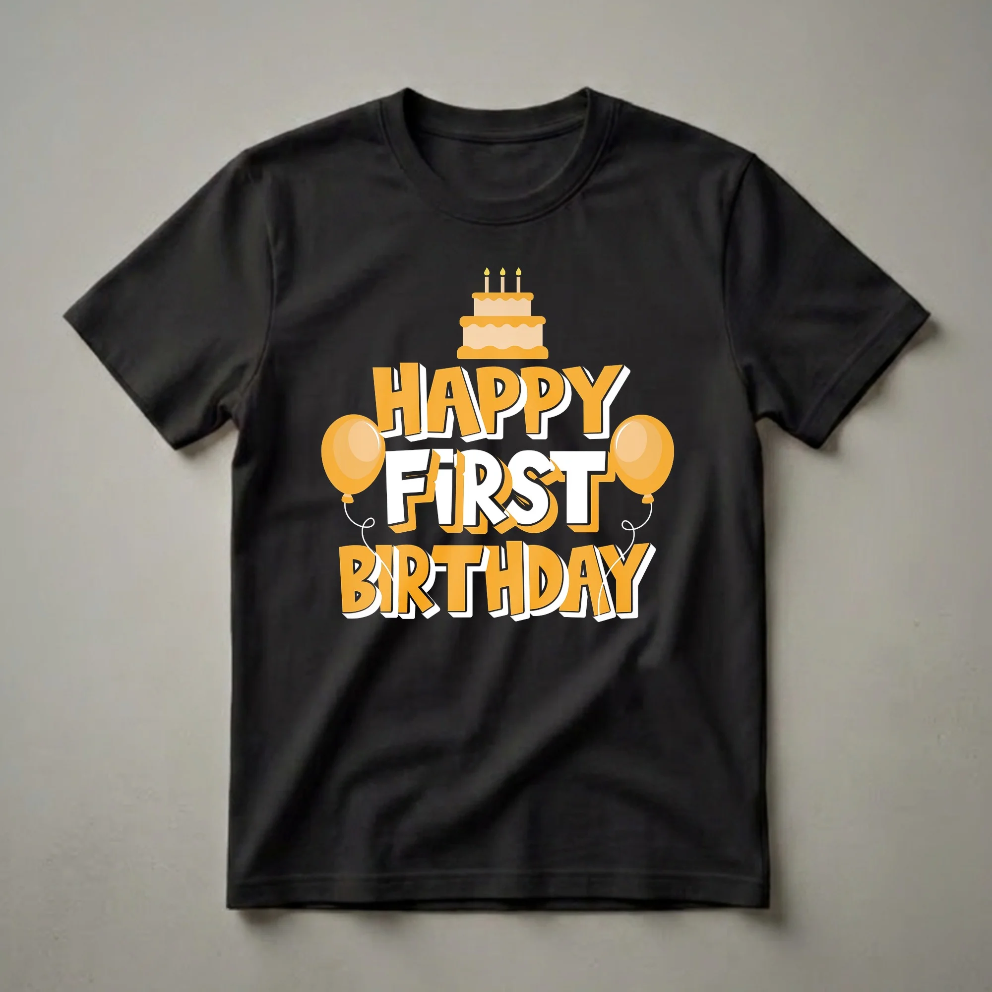 Black t-shirt with orange and white graphic text that reads 'HAPPY FIRST BIRTHDAY', featuring a cartoon cake with three candles and two orange balloons.