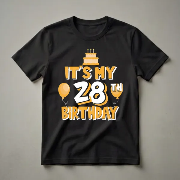 Black t-shirt with 'IT'S MY 28TH BIRTHDAY' text in orange and white, featuring a two-tier birthday cake with three candles and two orange balloons.