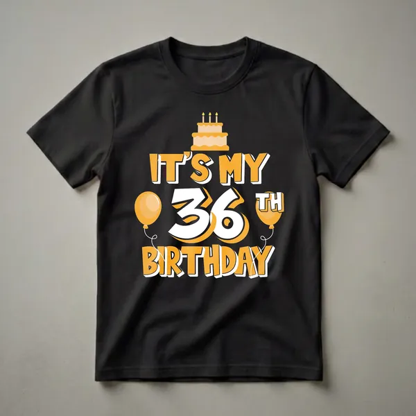 Black t-shirt with orange and white text that reads "IT'S MY 36TH BIRTHDAY" featuring a birthday cake with candles and two balloons.