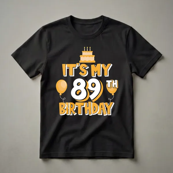Black t-shirt with orange and white graphic that reads 'IT'S MY 89TH BIRTHDAY' featuring a birthday cake and balloons.