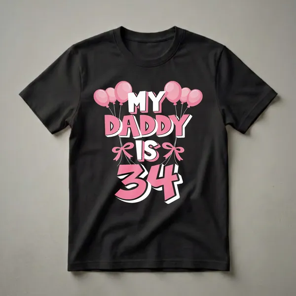 Black t-shirt with the text 'MY DADDY IS 34' in white and pink, adorned with pink balloons and bows.