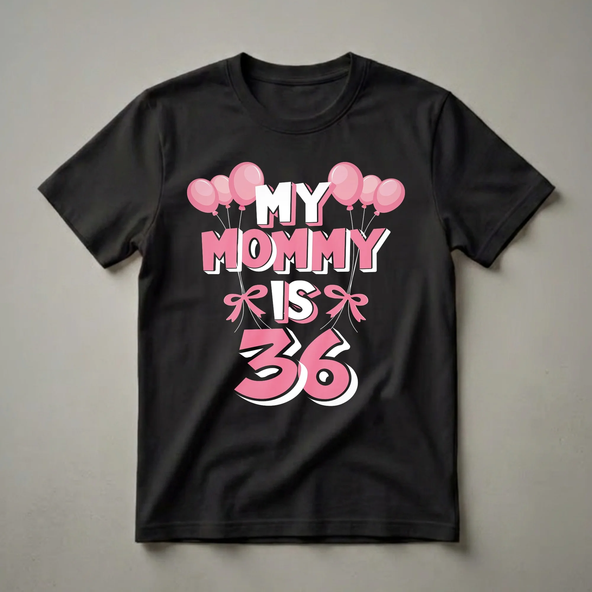 Black t-shirt with pink and white text that reads 'MY MOMMY IS 36', adorned with pink balloons and bows.