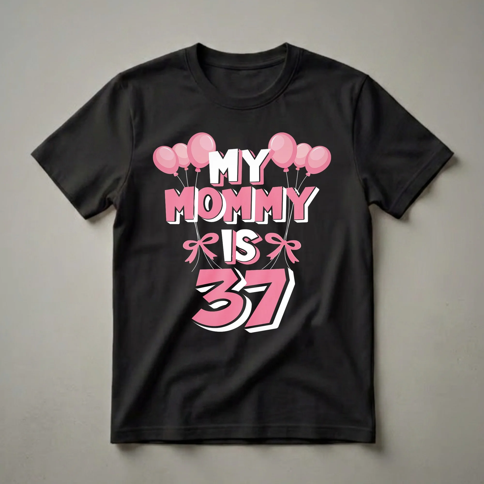 Black t-shirt with the text 'MY MOMMY IS 37' in pink and white, adorned with pink balloons and bows.