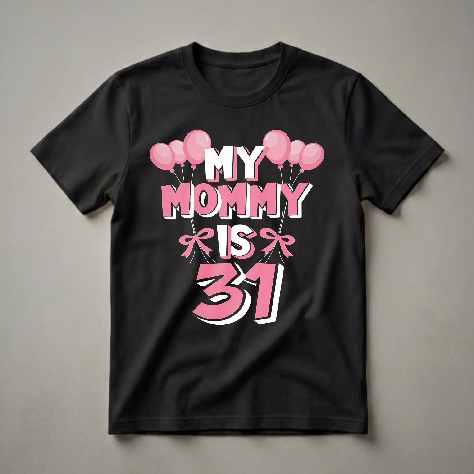 Black t-shirt with the text 'MY MOMMY IS 31' in large pink and white bubble letters, adorned with pink balloons and pink bows.