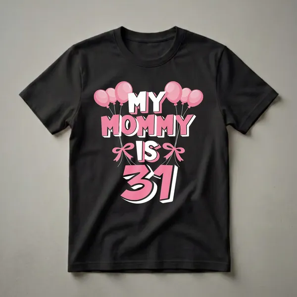 Black t-shirt with the text 'MY MOMMY IS 31' in large pink and white bubble letters, adorned with pink balloons and pink bows.