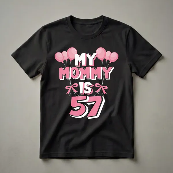 Black t-shirt with pink and white text that reads 'MY MOMMY IS 57' surrounded by pink balloons and pink bows.