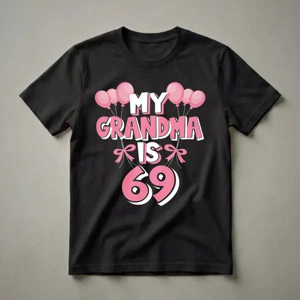 Black t-shirt with the text 'MY GRANDMA IS 69' in large pink and white letters, adorned with pink balloons and pink bows.