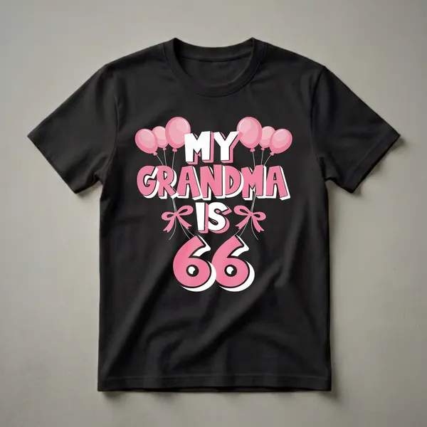 Black t-shirt with pink and white text that reads "MY GRANDMA IS 66" surrounded by pink balloons and bows, celebrating a 66th birthday.