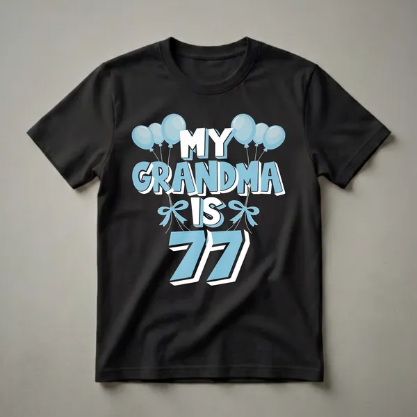 A black t-shirt with the text "MY GRANDMA IS 77" in large, light blue and white lettering, adorned with light blue balloons and bows, celebrating a 77th birthday.
