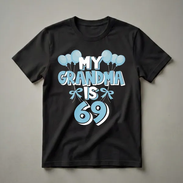 Black t-shirt with light blue and white text that reads 'MY GRANDMA IS 69' surrounded by light blue balloons and bows.