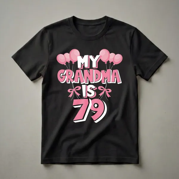 Black t-shirt with pink and white text that reads "MY GRANDMA IS 79" surrounded by pink balloons and bows.