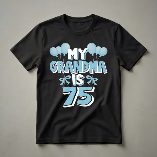 Black t-shirt with light blue and white text that reads 'MY GRANDMA IS 75' surrounded by light blue balloons and bows.