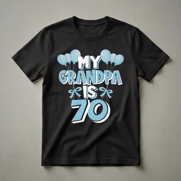 A black t-shirt with the text 'MY GRANDPA IS 70' in white and light blue, surrounded by light blue balloons and bows.
