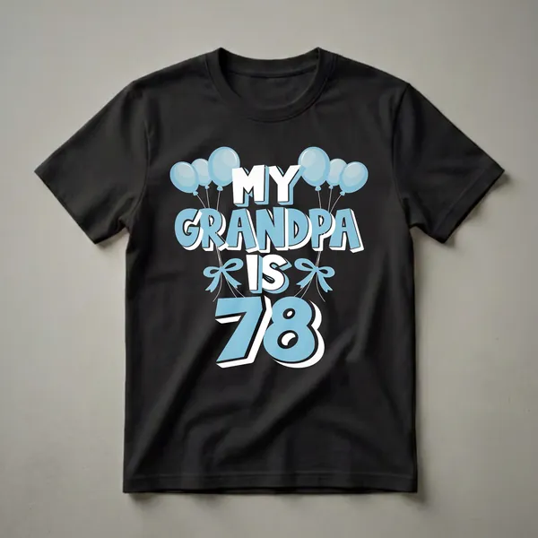 Black t-shirt with light blue and white text that reads "MY GRANDPA IS 78" surrounded by light blue balloons and bows.