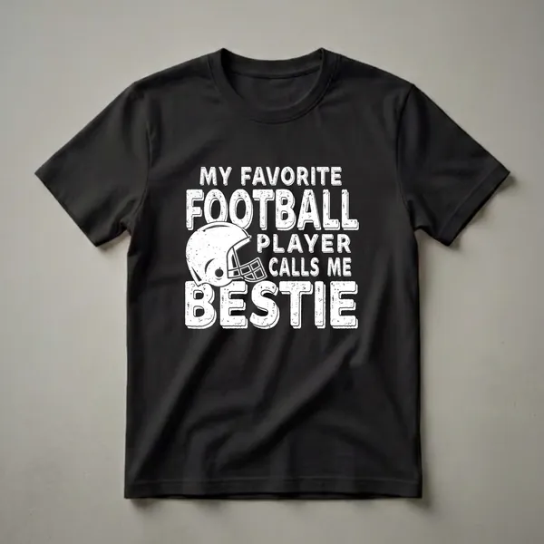 White distressed graphic t-shirt with the text 'MY FAVORITE FOOTBALL PLAYER CALLS ME BESTIE' and a football helmet.