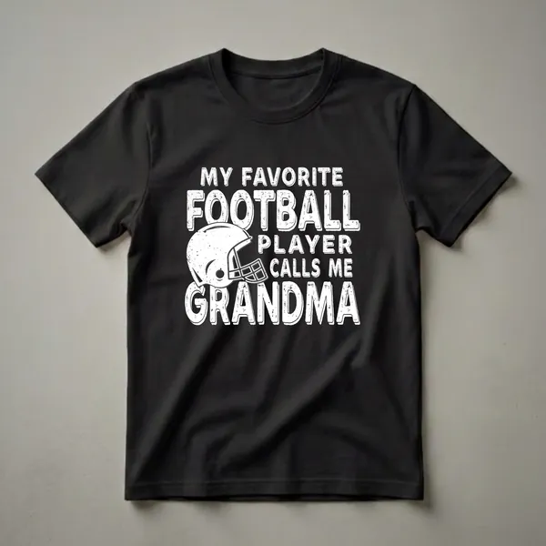 Black t-shirt with white distressed text that reads "My Favorite Football Player Calls Me Grandma" and a white distressed football helmet graphic.