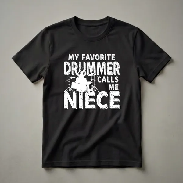 White distressed graphic t-shirt with the text 'MY FAVORITE DRUMMER CALLS ME NIECE' and a silhouette of a drummer on a drum set.