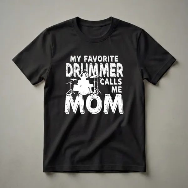 Black t-shirt with white distressed text that reads 'MY FAVORITE DRUMMER CALLS ME MOM' and a white silhouette graphic of a drummer playing a drum set.