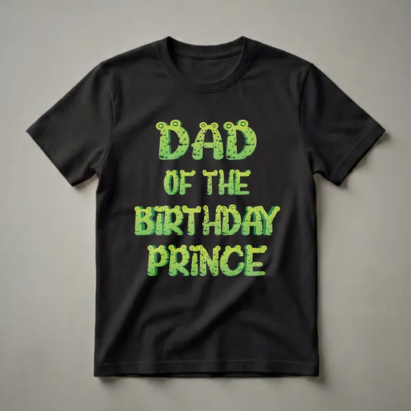 Green frog-textured graphic t-shirt that reads 'DAD OF THE BIRTHDAY PRINCE' in a playful, 3D font.