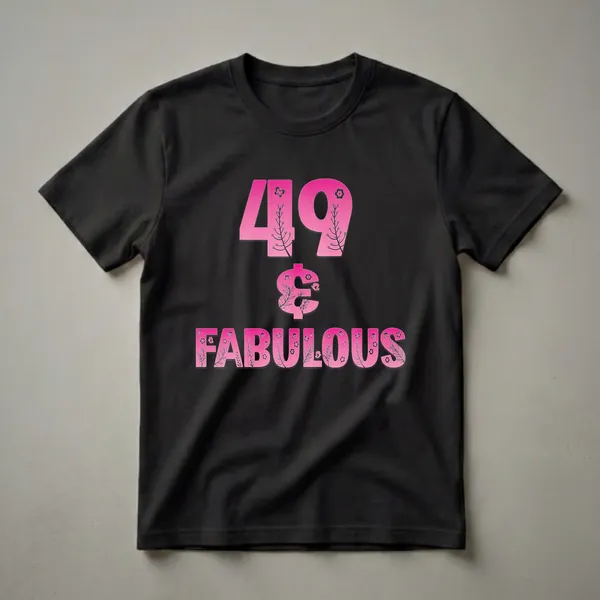 Pink gradient graphic t-shirt with black floral and butterfly designs, displaying '49 & FABULOUS' text on a black background.
