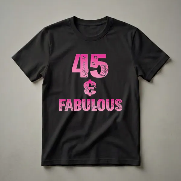 A black t-shirt featuring the number '45' and the word 'FABULOUS' in large pink gradient letters, decorated with floral branches and butterflies.