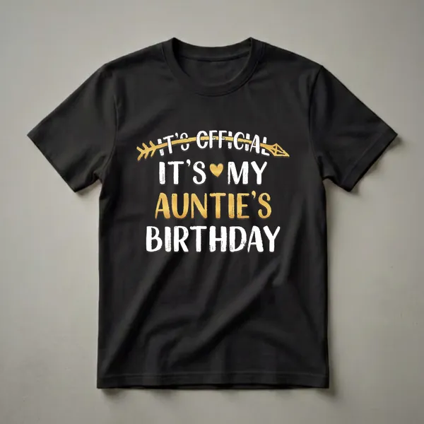 Black t-shirt with white and gold text that reads 'It's Official It's My Auntie's Birthday,' featuring a golden arrow and a golden heart.