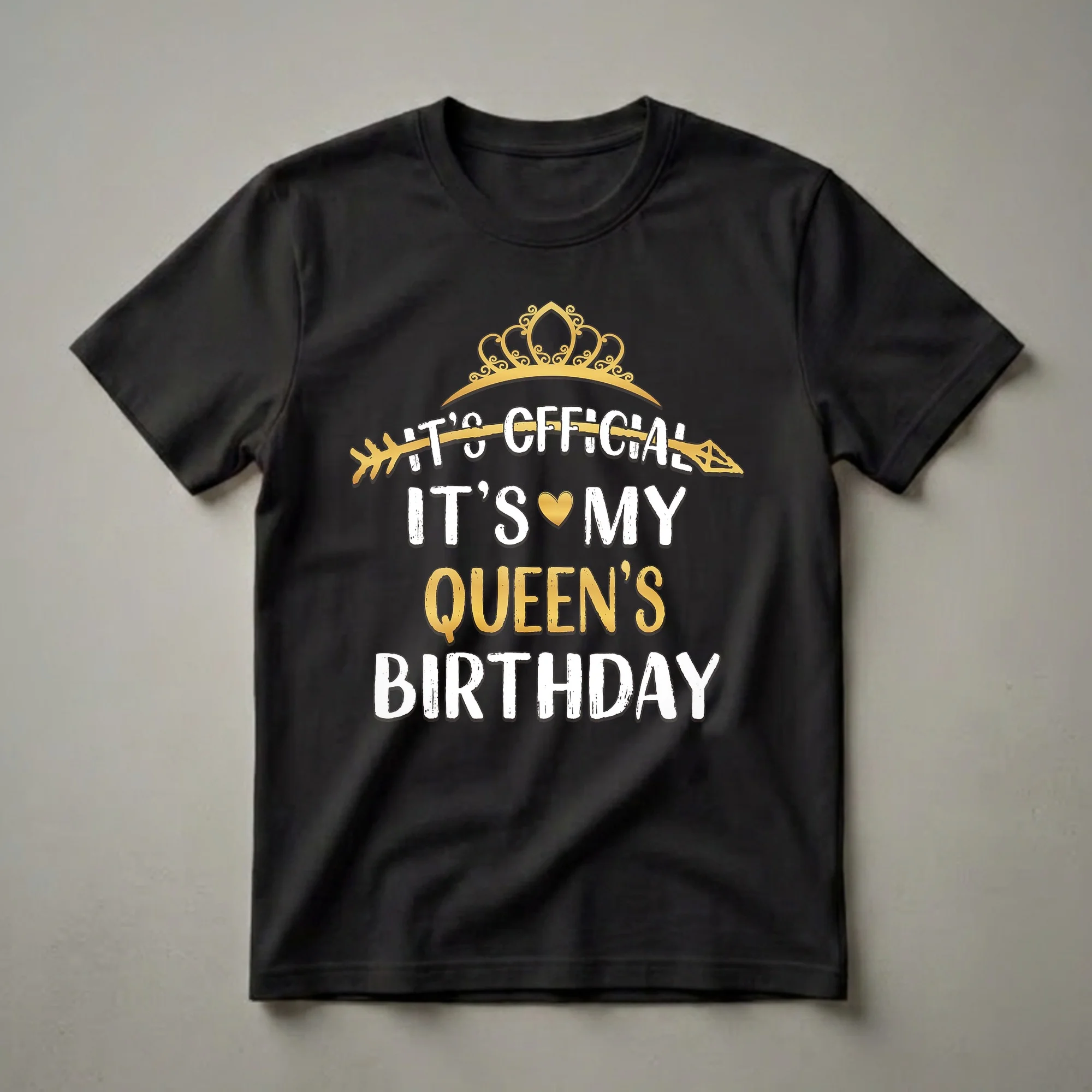 Black t-shirt with white and gold text that reads 'IT'S OFFICIAL IT'S MY QUEEN'S BIRTHDAY', featuring a golden crown and arrow graphic.