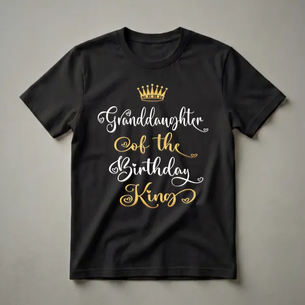 Black t-shirt with white and gold script text reading 'Granddaughter Of The Birthday King' and a golden crown graphic above the text.